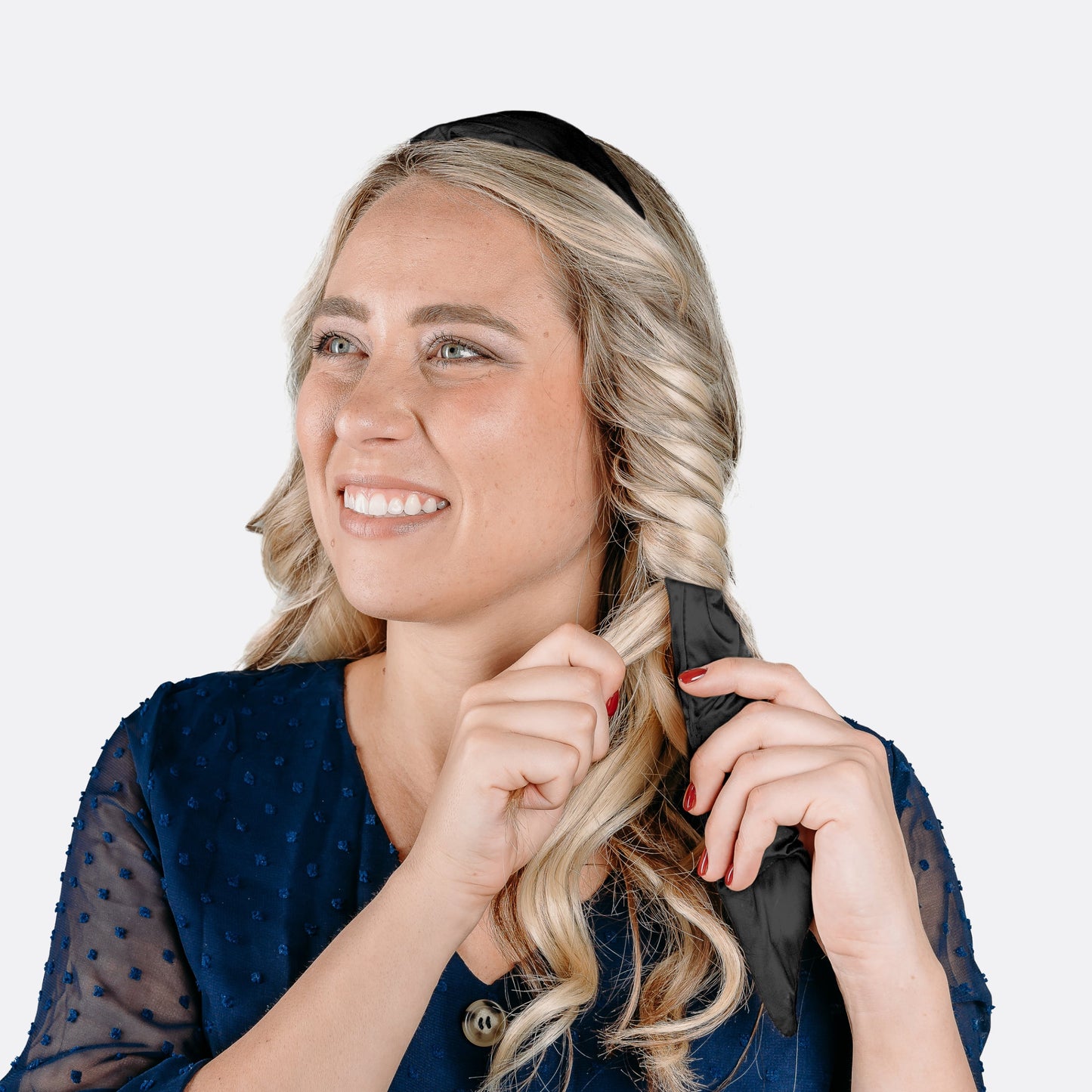 Women wrapping her hair around the curling headband